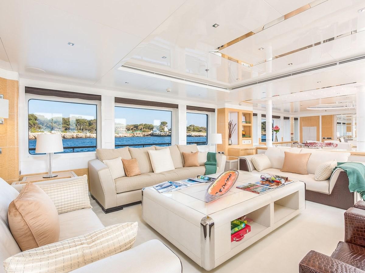 a living room with a large window aboard JADE 959 Yacht for Sale