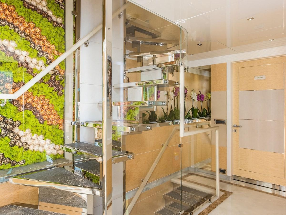 a large glass wall with shelves aboard JADE 959 Yacht for Sale