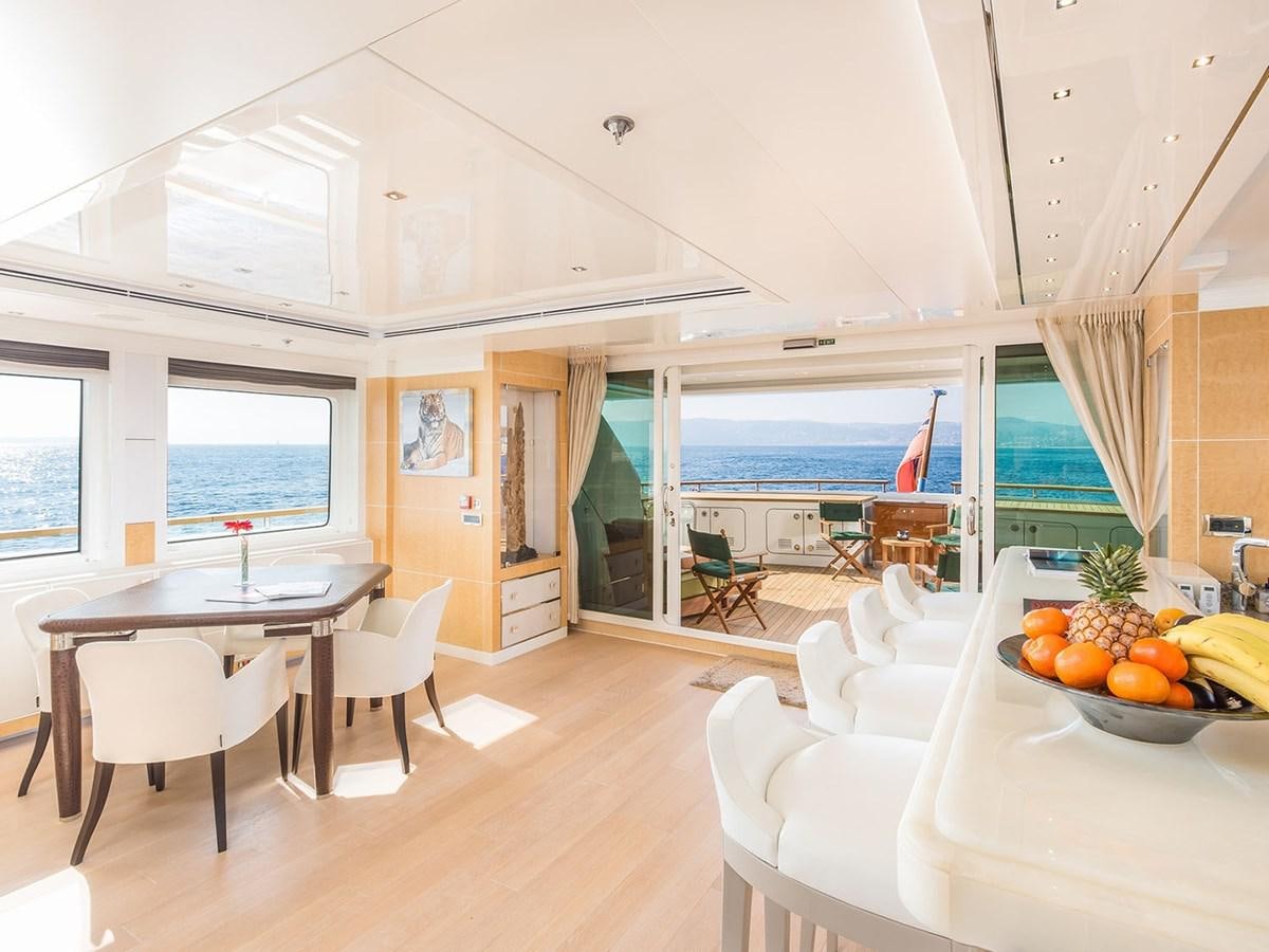 a large open kitchen and dining area aboard JADE 959 Yacht for Sale