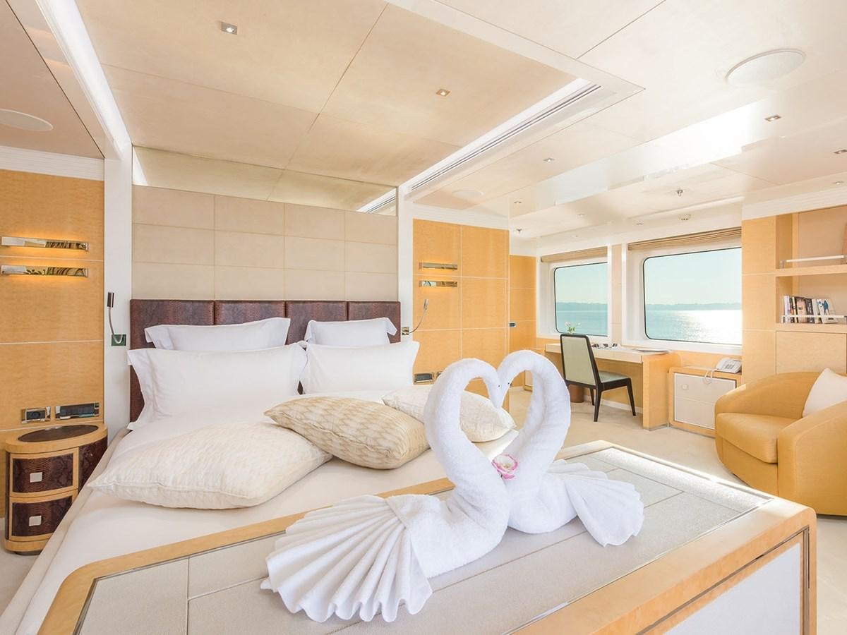 a large bed in a room aboard JADE 959 Yacht for Sale