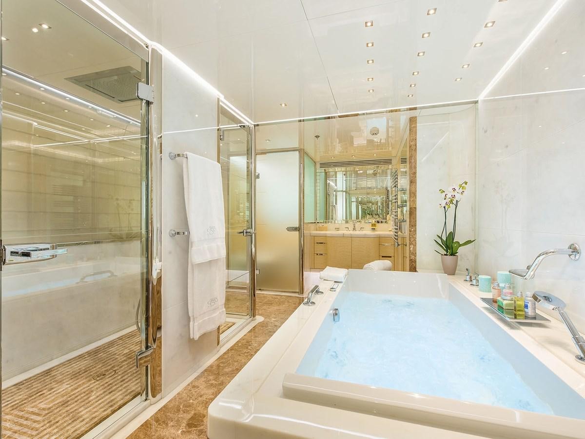 a bathroom with a tub and shower aboard JADE 959 Yacht for Sale