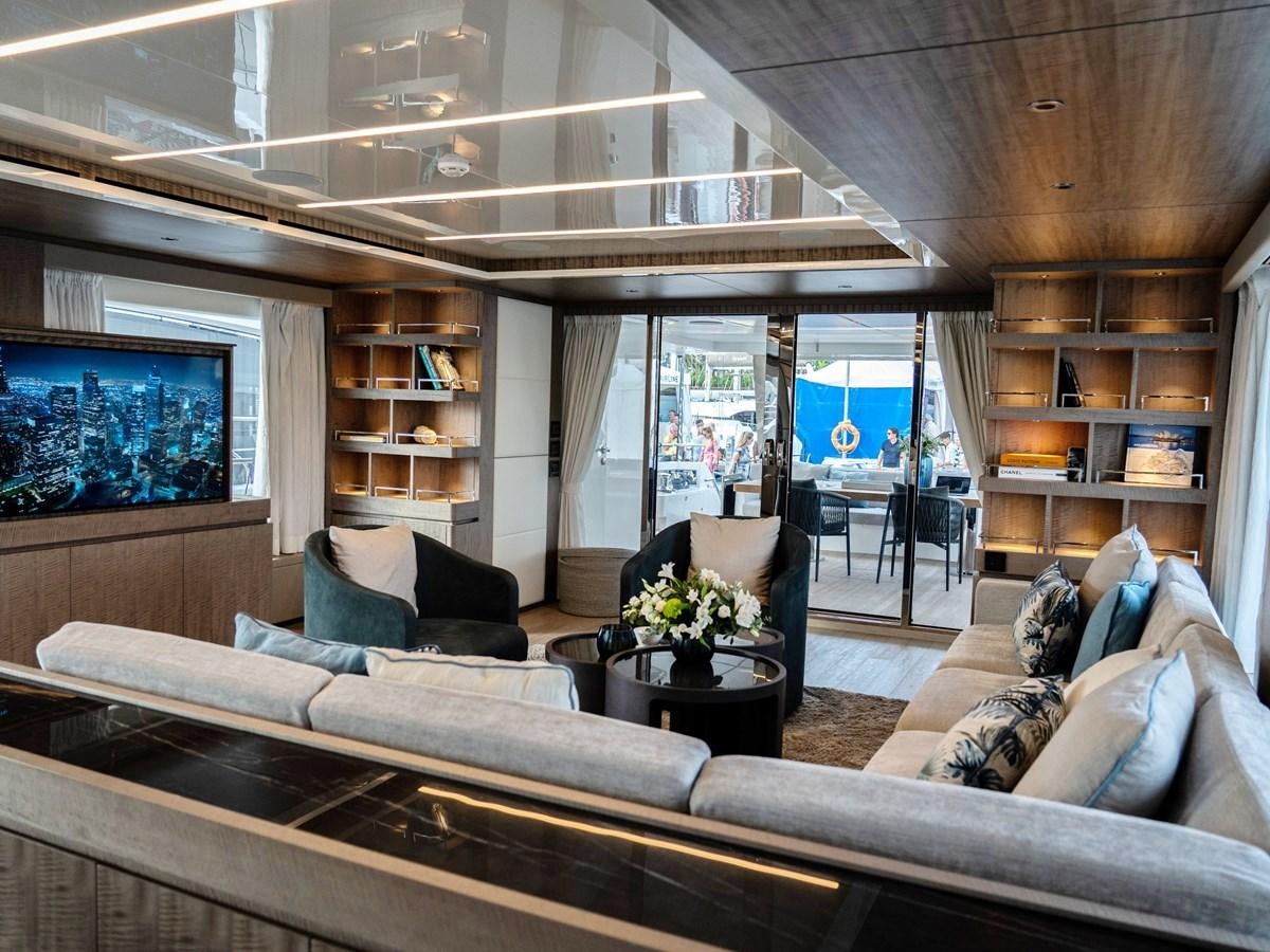 a living room with a large sofa aboard NIXTUN Yacht for Sale