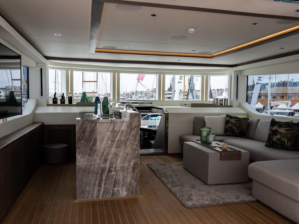 a living room with a couch and a table aboard NIXTUN Yacht for Sale