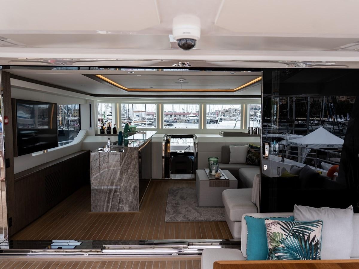 a room with a couch and a television aboard NIXTUN Yacht for Sale