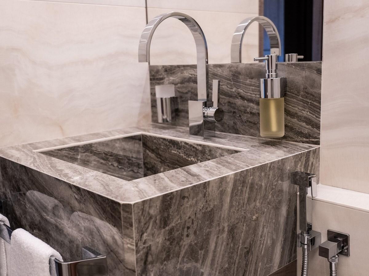 a bathroom with a large mirror aboard NIXTUN Yacht for Sale