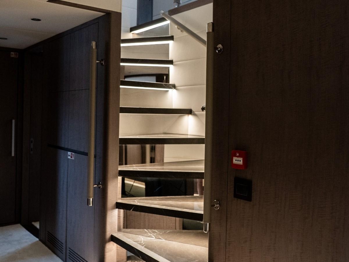 a room with a blue door and a metal shelf with a black door aboard NIXTUN Yacht for Sale