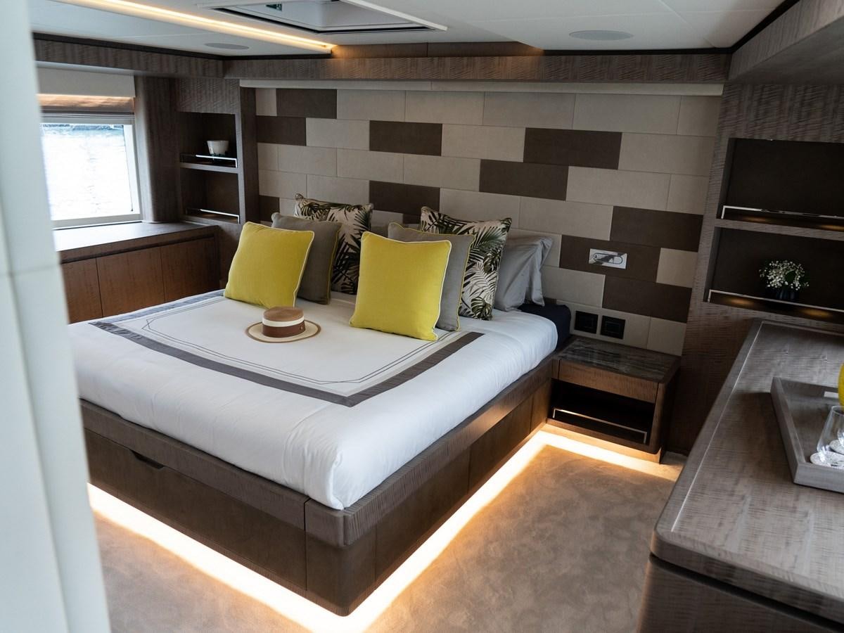 a large bed in a room aboard NIXTUN Yacht for Sale