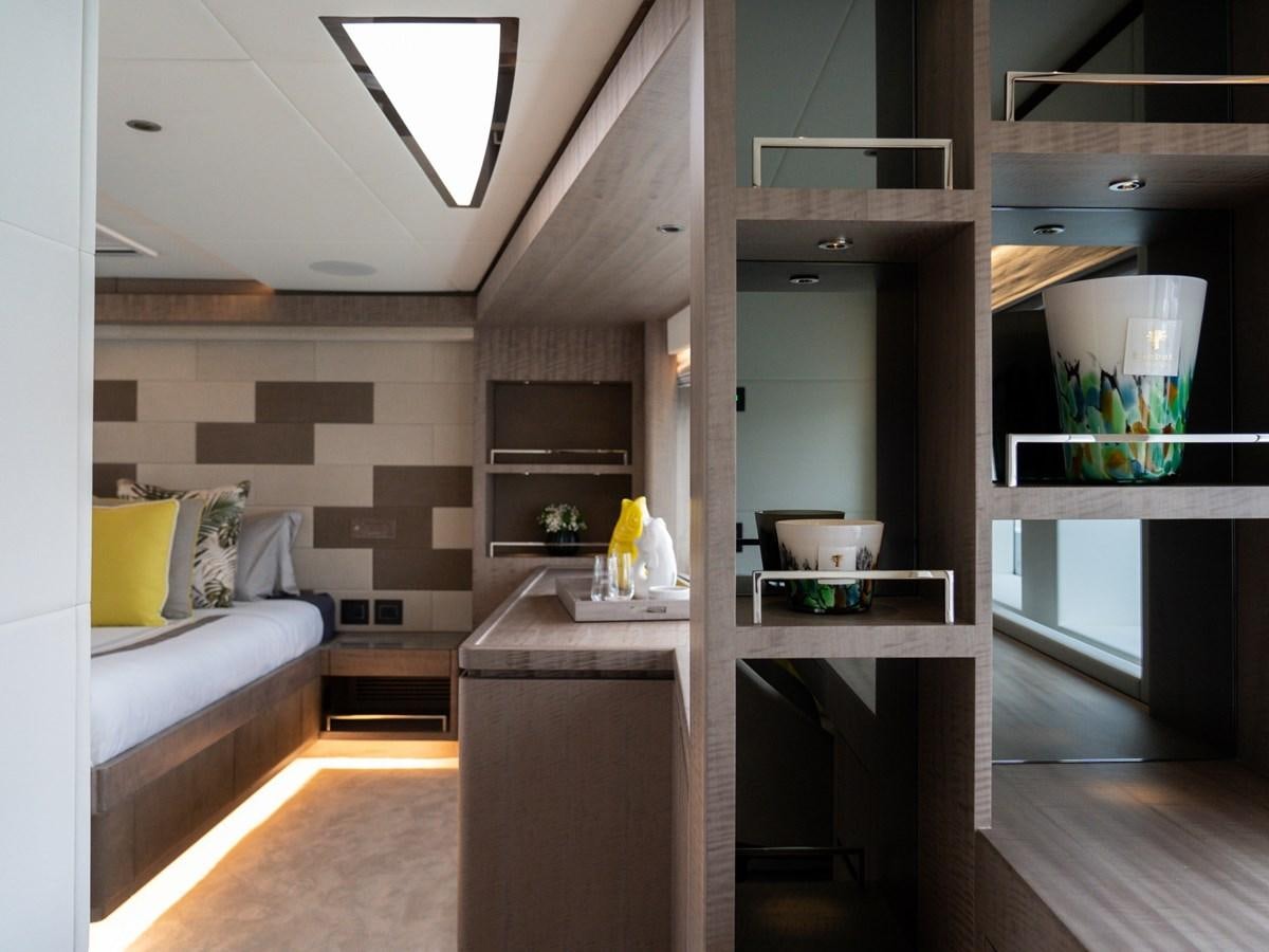 a room with a bed and a table aboard NIXTUN Yacht for Sale