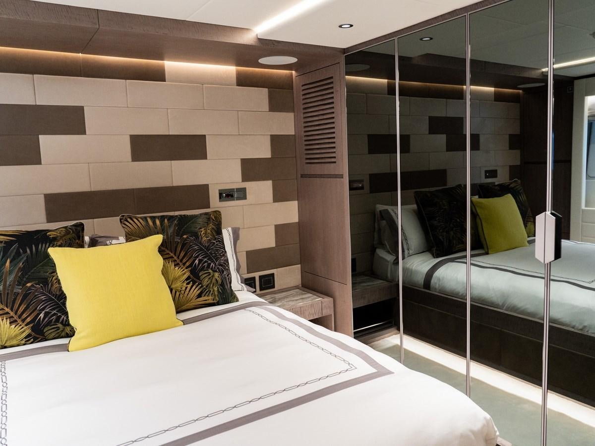 a room with a bed and a mirror aboard NIXTUN Yacht for Sale