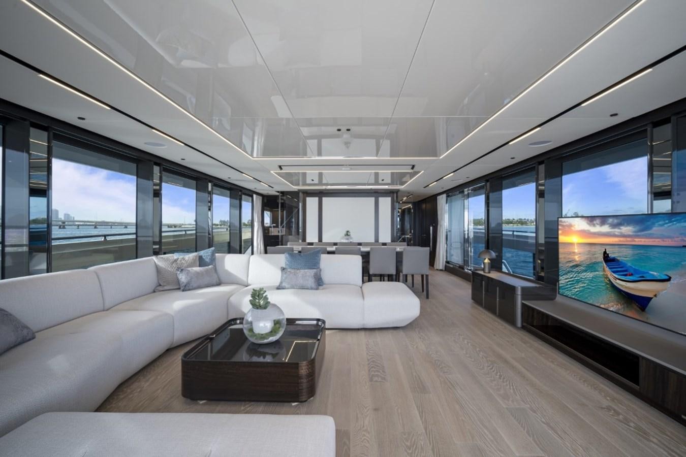 a living room with a large screen aboard SUNSEEKER 90/25 Yacht for Sale
