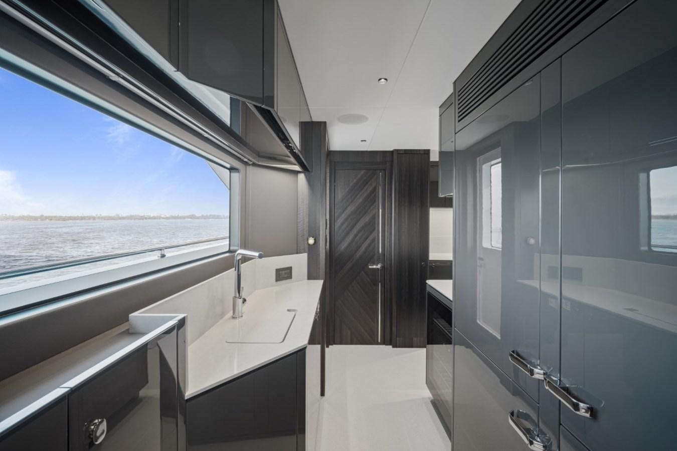 a bathroom with a tub sink and a window aboard SUNSEEKER 90/25 Yacht for Sale