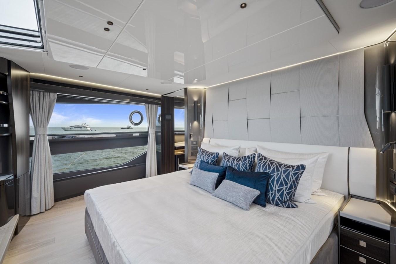 a large bed in a room aboard SUNSEEKER 90/25 Yacht for Sale