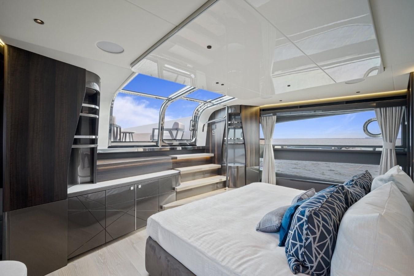 a room with a bed and a window aboard SUNSEEKER 90/25 Yacht for Sale