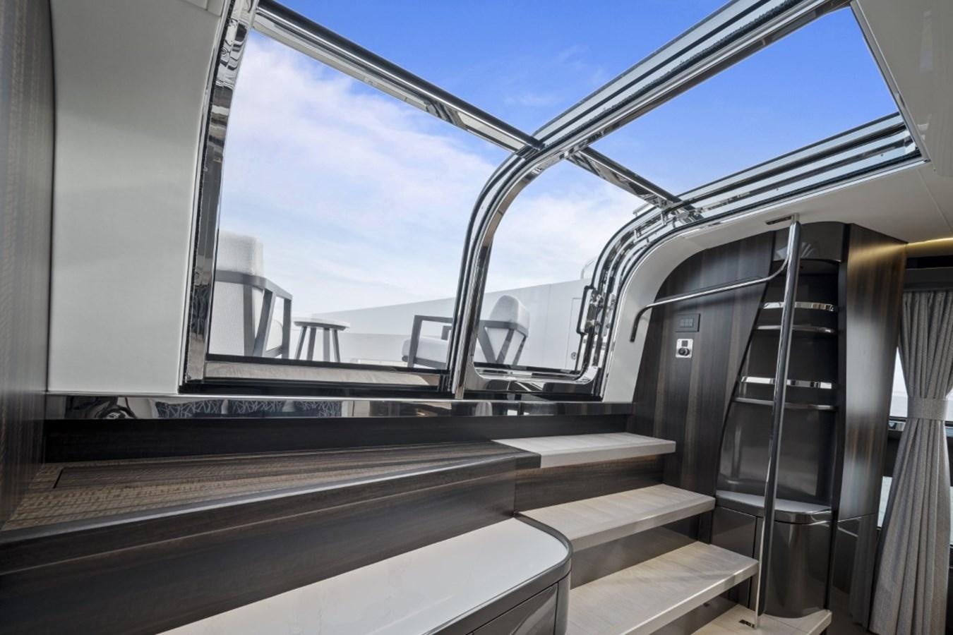 a view of a city through a glass window aboard SUNSEEKER 90/25 Yacht for Sale