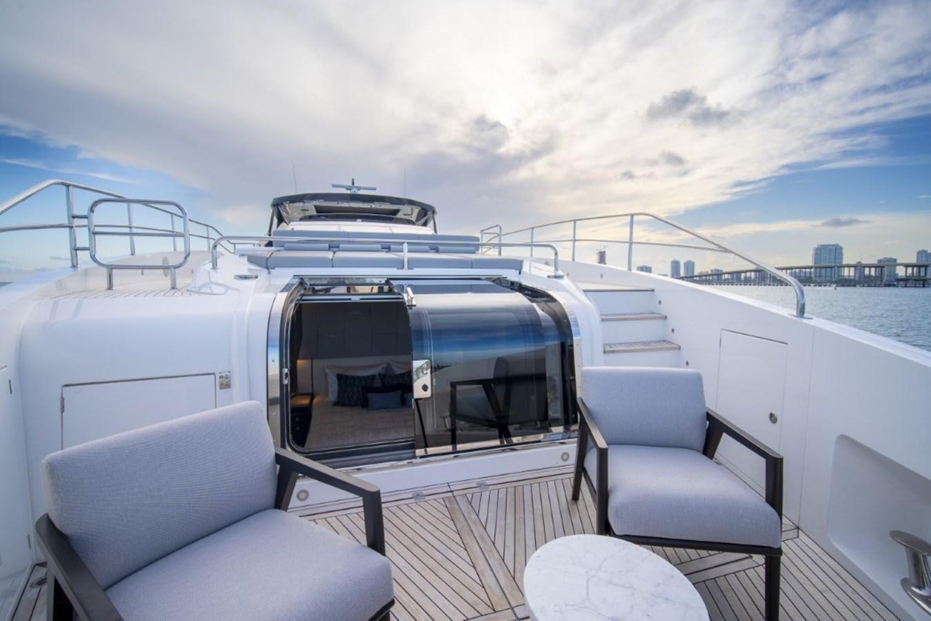 a boat with a chair and a table on it aboard SUNSEEKER 90/25 Yacht for Sale