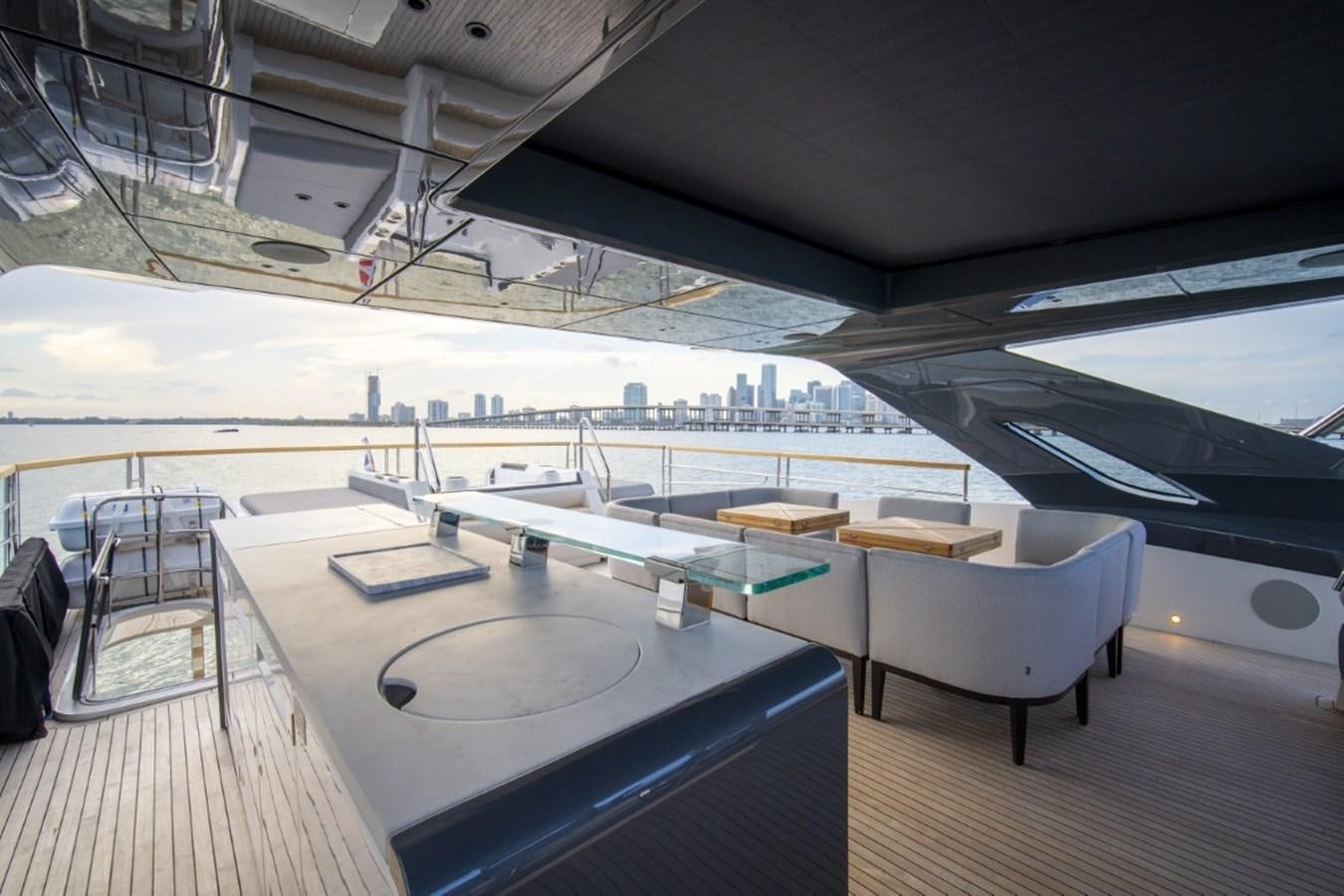 a large room with a table and chairs aboard SUNSEEKER 90/25 Yacht for Sale