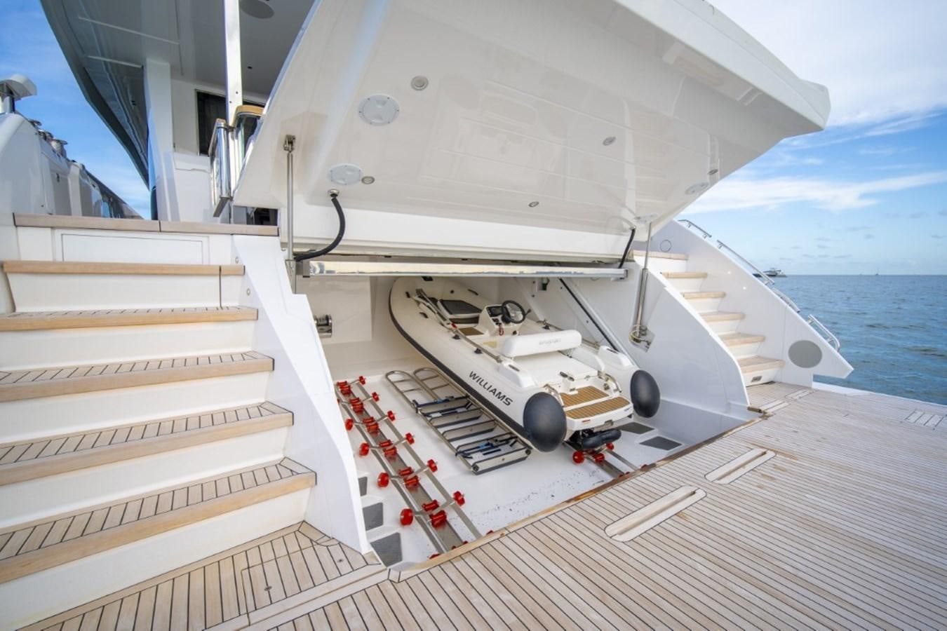 a white boat on a deck aboard SUNSEEKER 90/25 Yacht for Sale