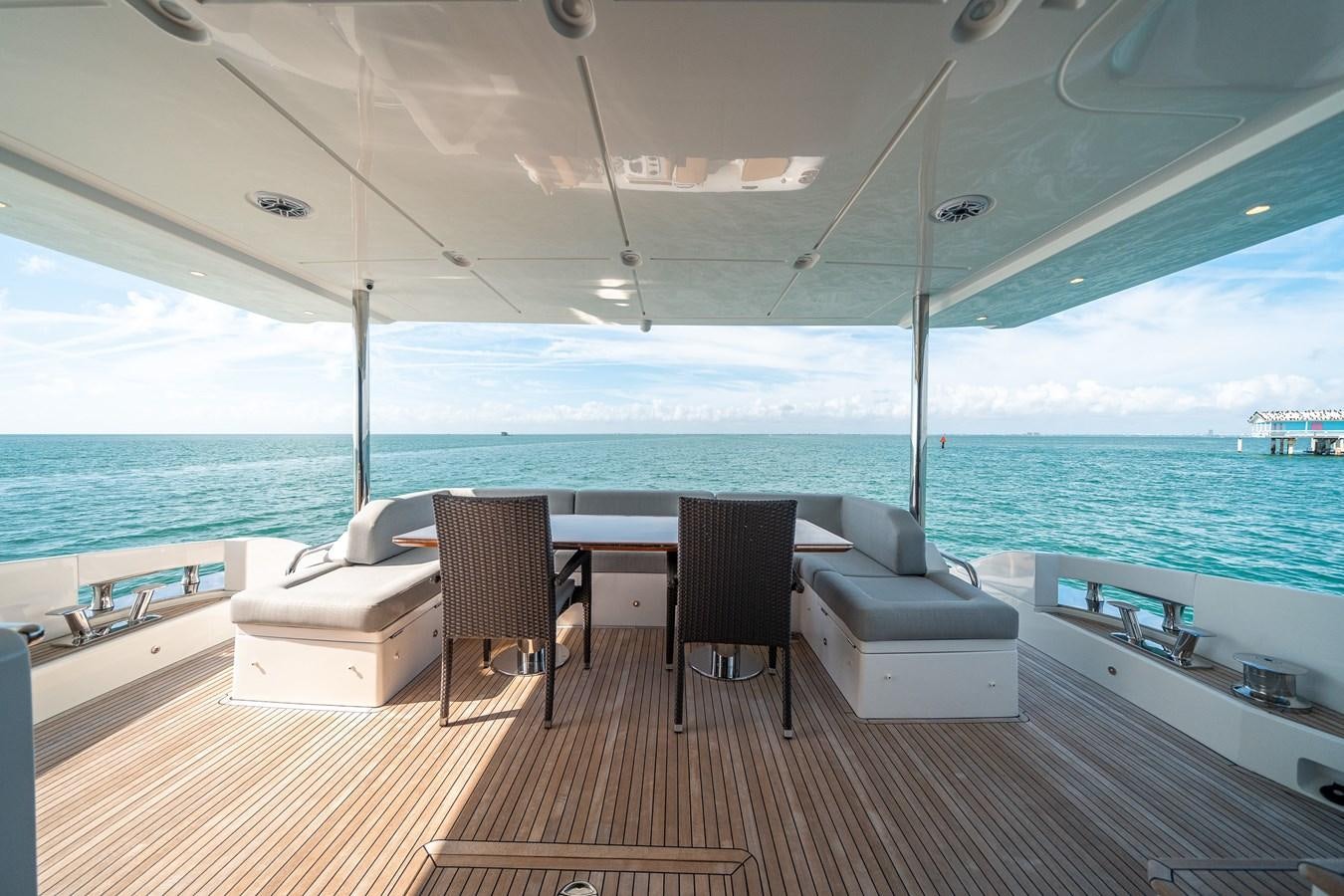 a room with a table and chairs aboard 80 AZIMUT Yacht for Sale
