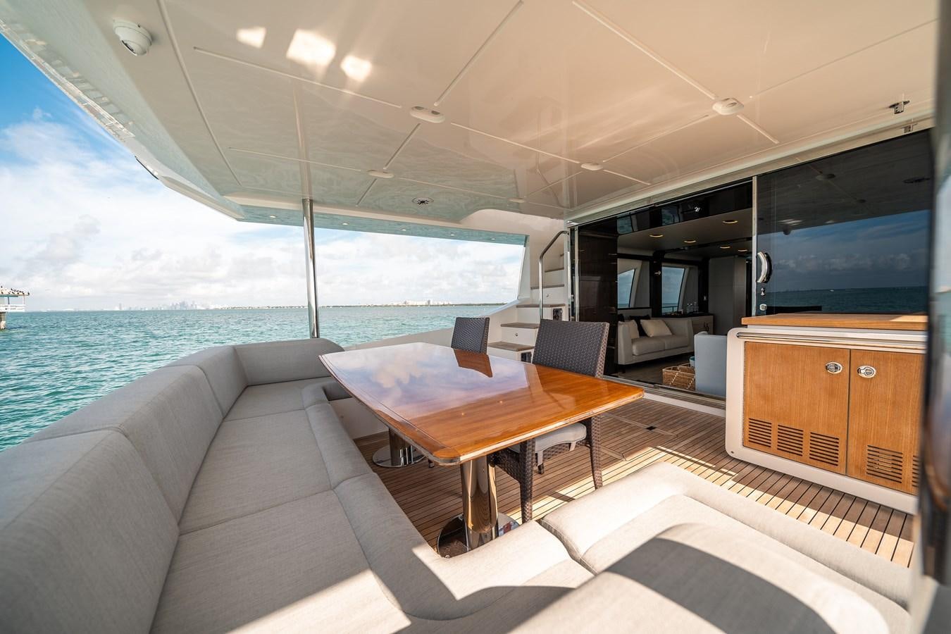 a room with a table and chairs aboard 80 AZIMUT Yacht for Sale