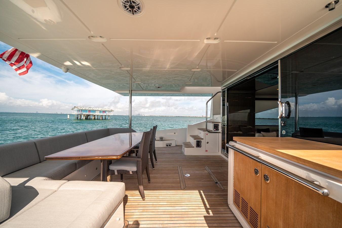 a room with a view of the ocean and the deck aboard 80 AZIMUT Yacht for Sale
