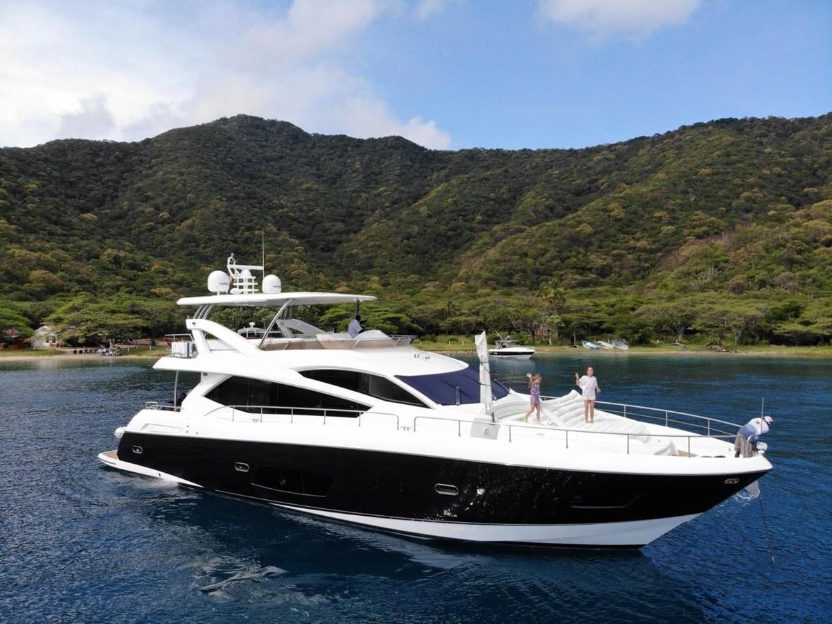 a couple people on a boat aboard SUNSEEKER 74 2012 SEA C Yacht for Sale