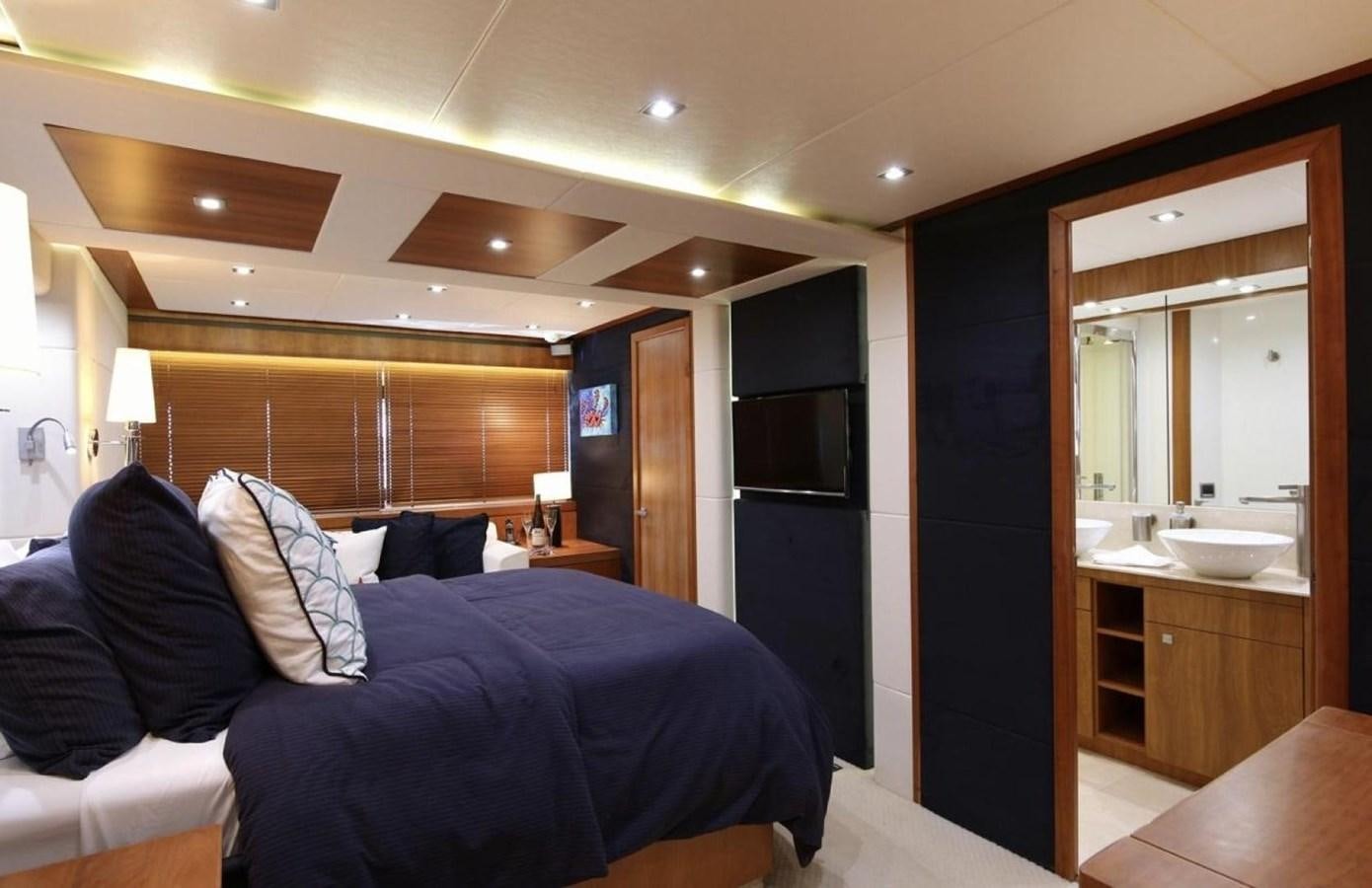 a bedroom with a bed and a sink aboard SUNSEEKER 74 2012 SEA C Yacht for Sale