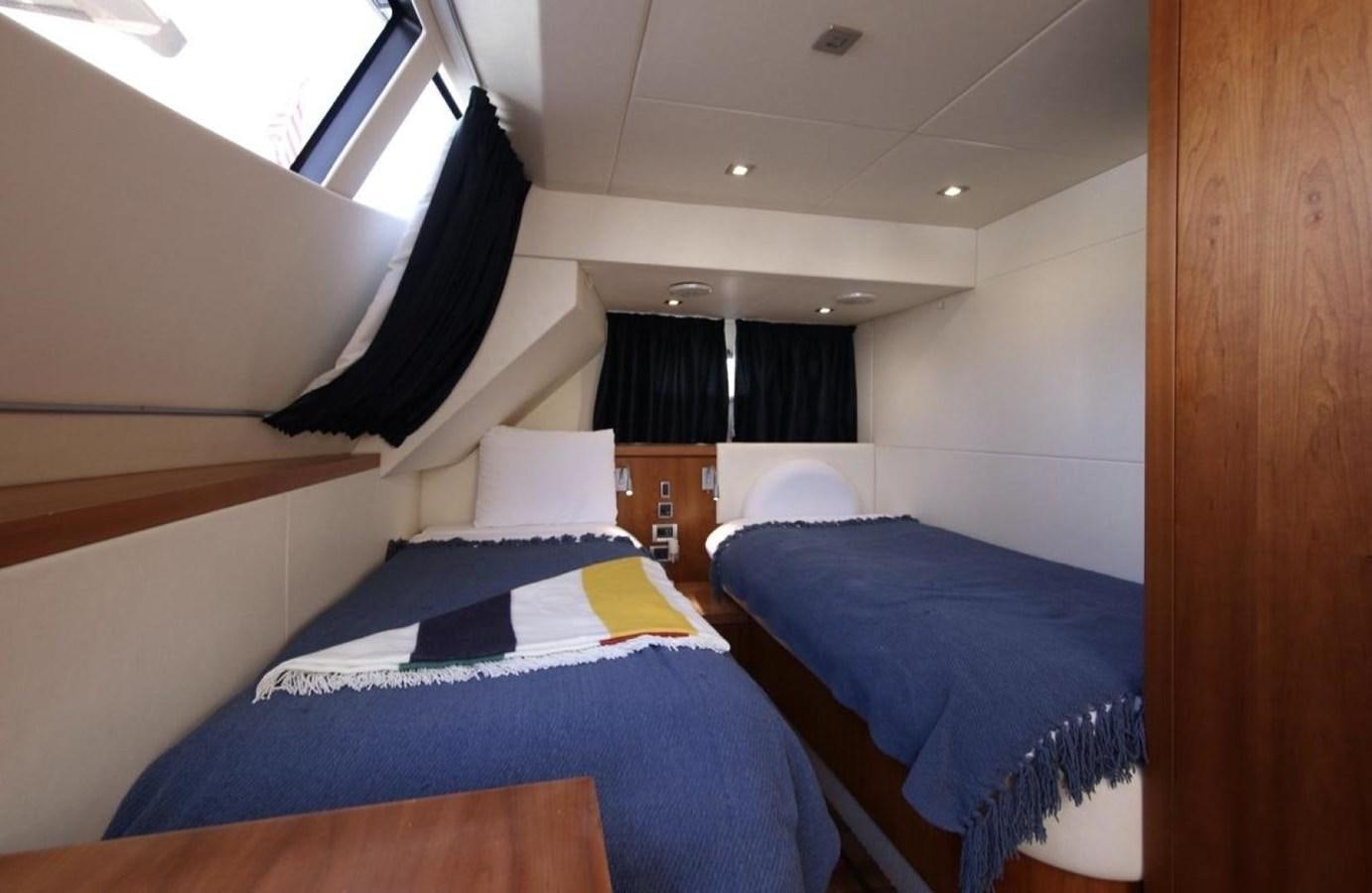 a room with bunk beds aboard SUNSEEKER 74 2012 SEA C Yacht for Sale