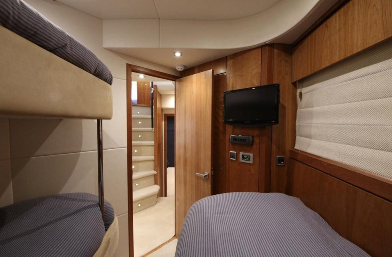 a room with a tv and a bed aboard SUNSEEKER 74 2012 SEA C Yacht for Sale