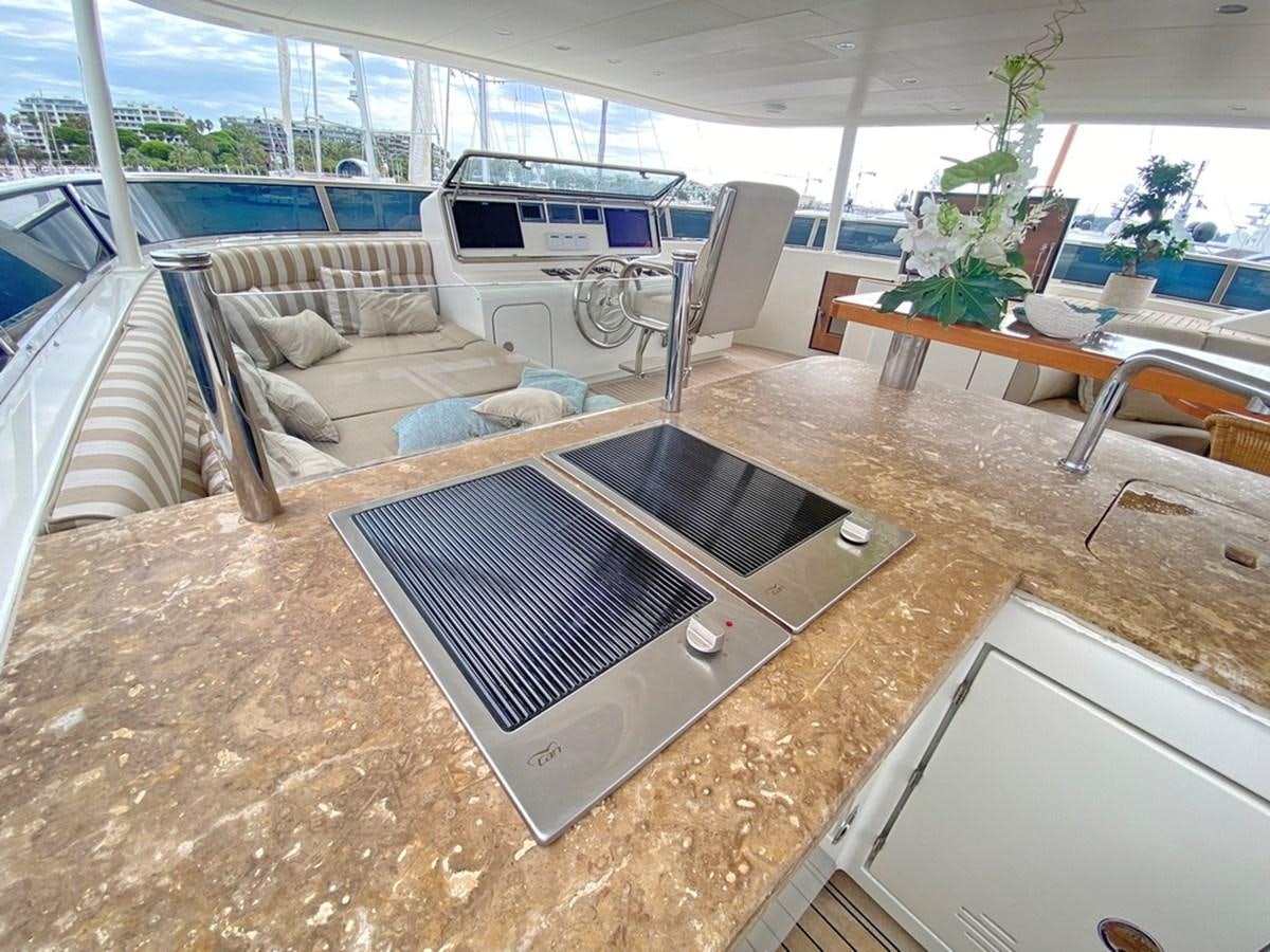 a large room with a large barbecue aboard O Yacht for Sale