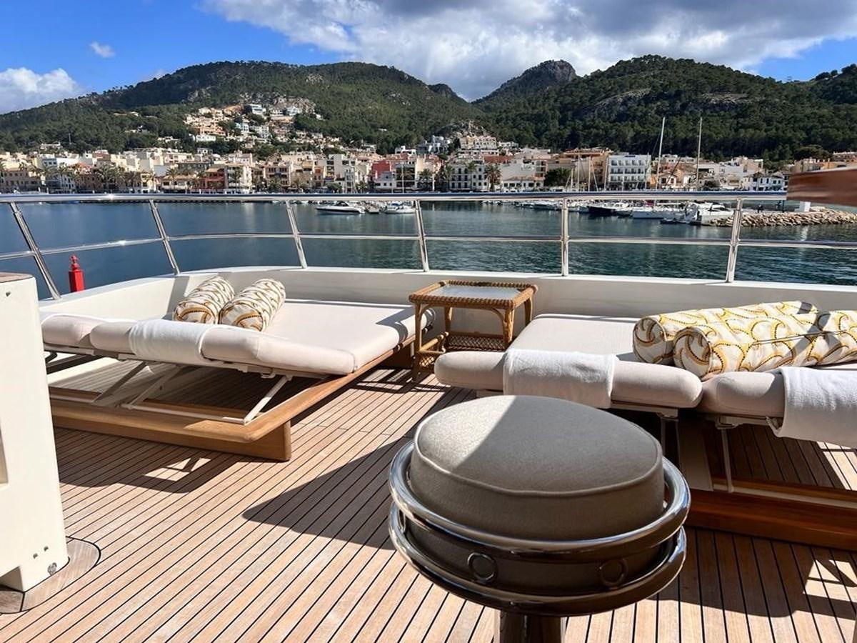 a deck with a view of a city and a body of water aboard O Yacht for Sale