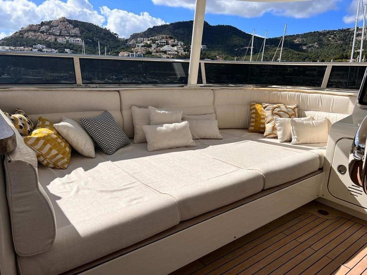 a large white couch with pillows aboard O Yacht for Sale