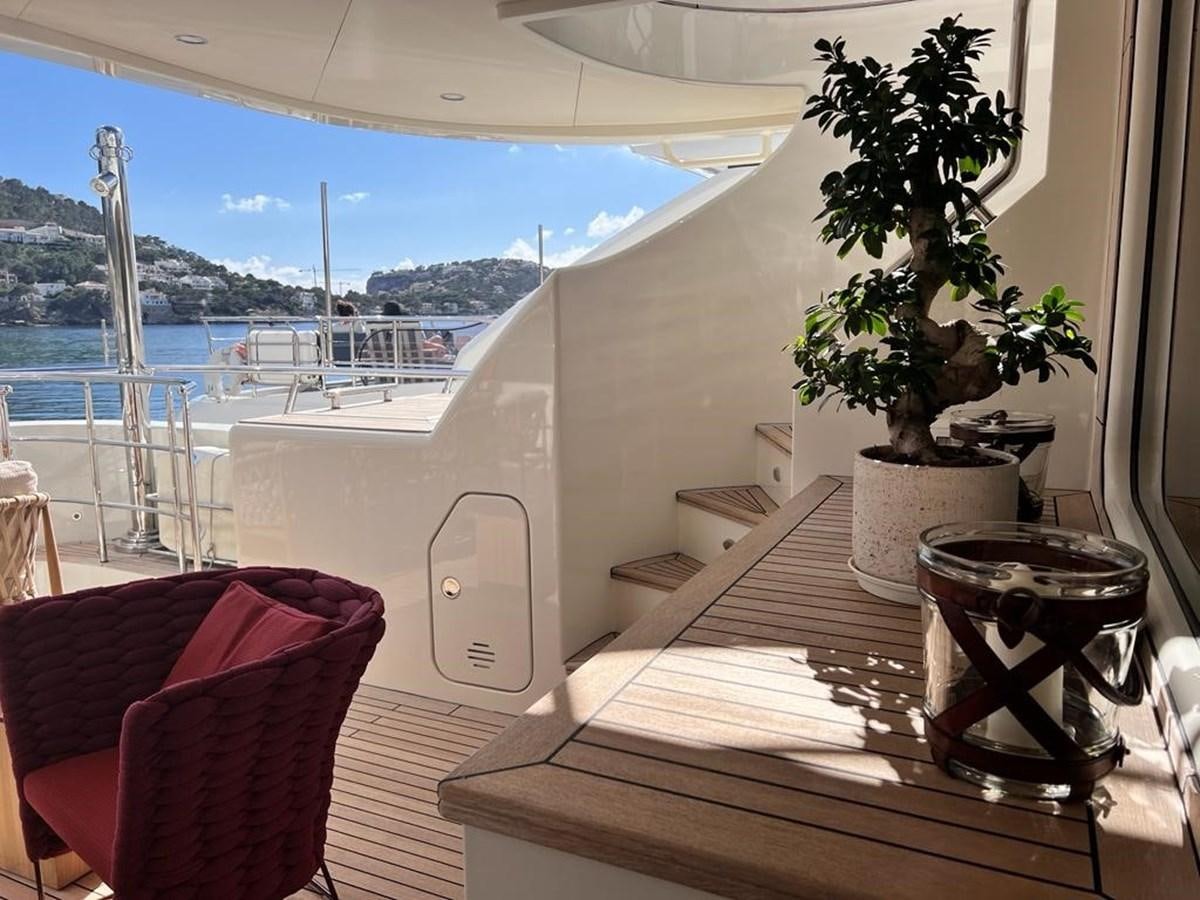 a table with a plant on it aboard O Yacht for Sale