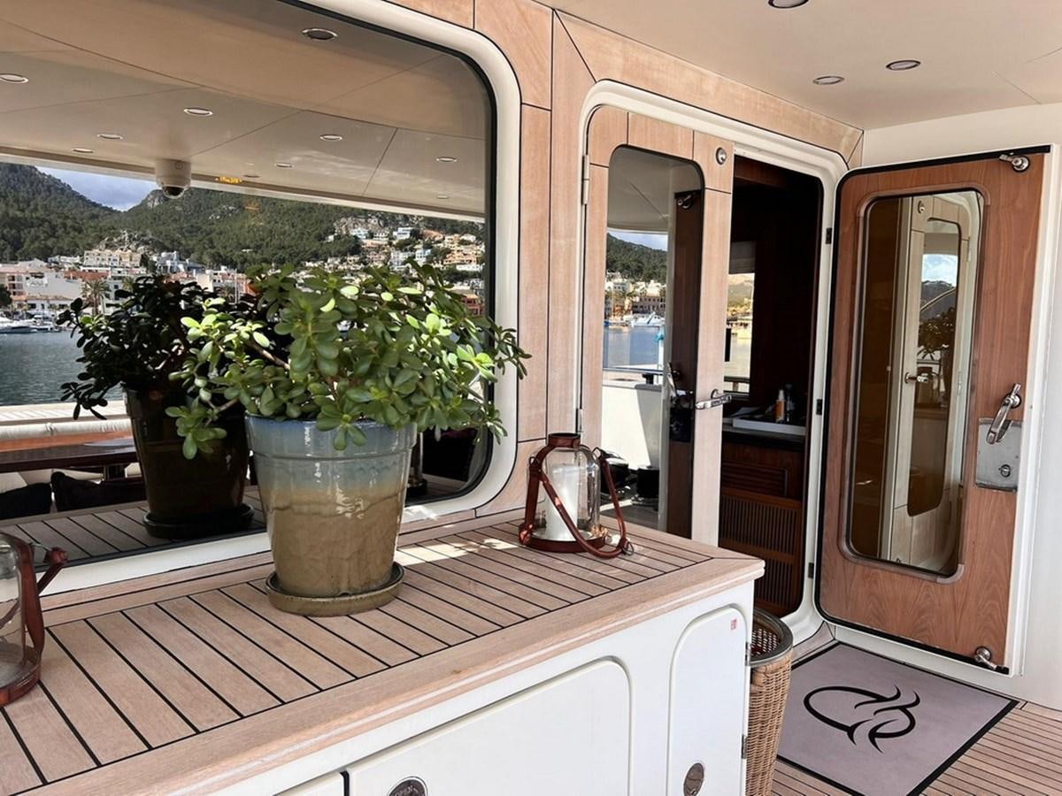 a kitchen with plants in pots aboard O Yacht for Sale