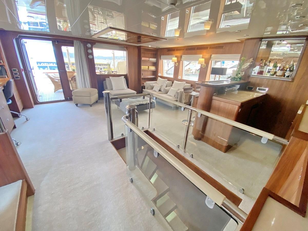 a room with a couch and a table aboard O Yacht for Sale