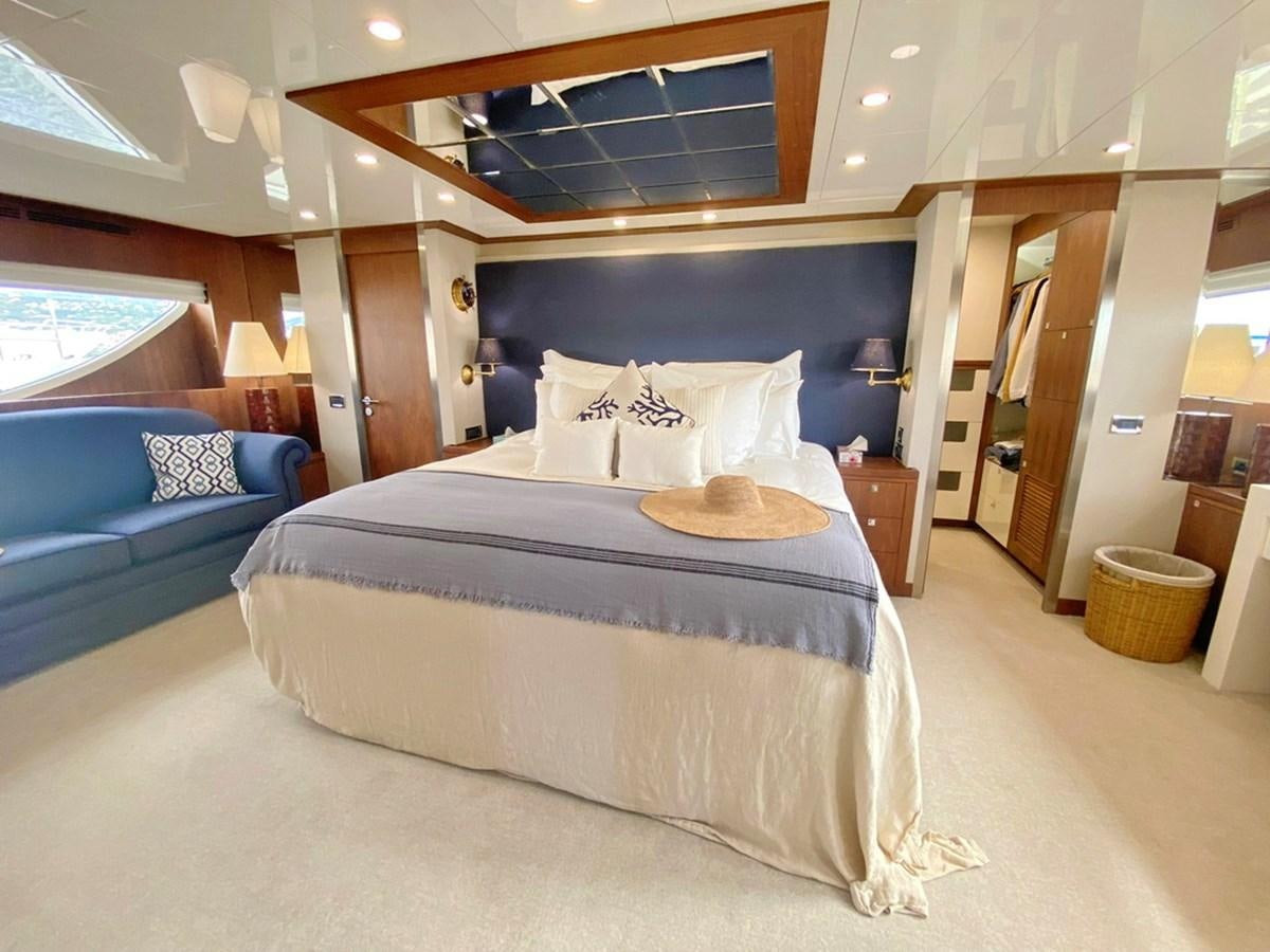 a large bed in a room aboard O Yacht for Sale