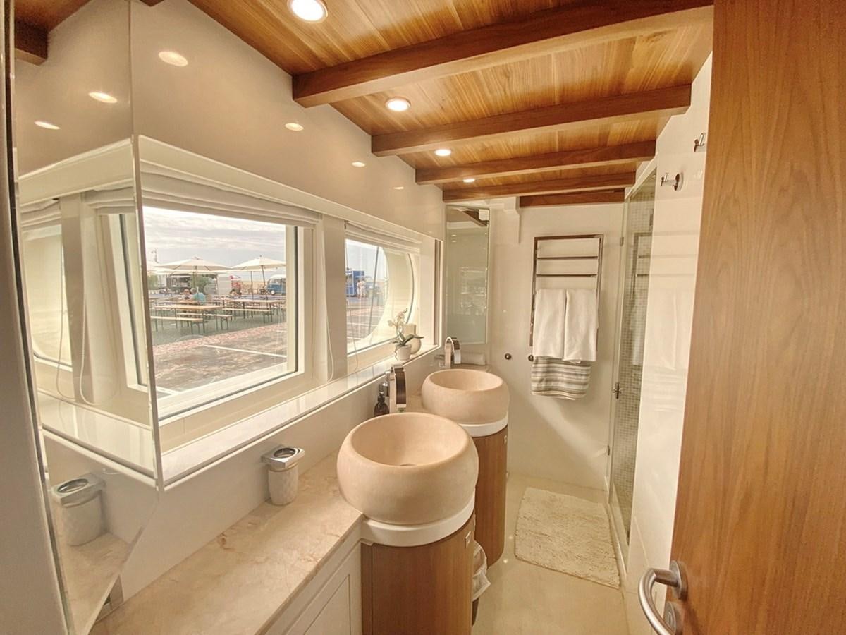 a bathroom with a toilet and a sink aboard O Yacht for Sale