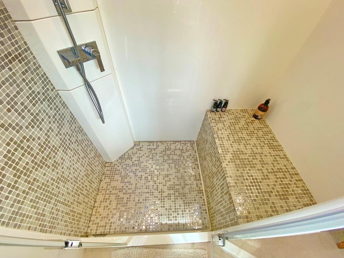 a small bathroom with a tile floor aboard O Yacht for Sale