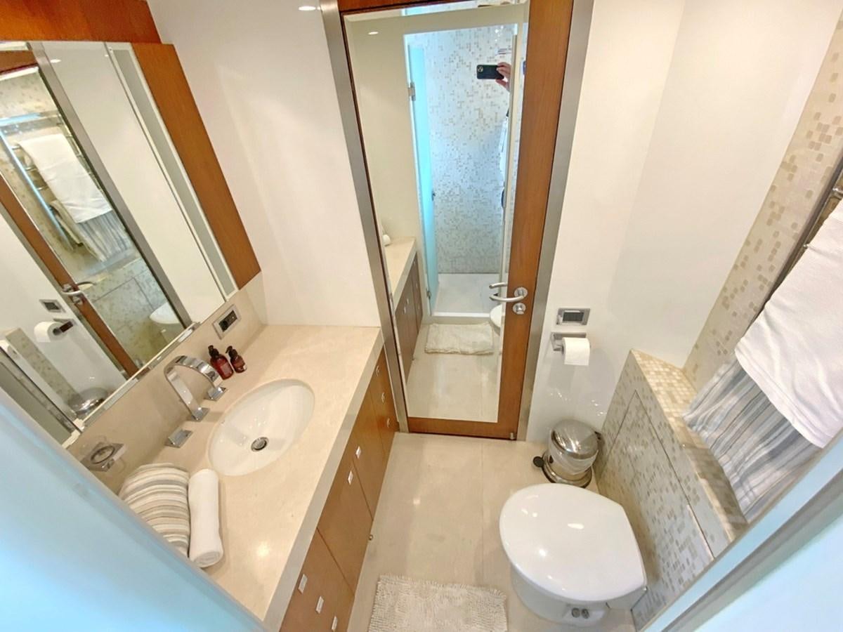 a bathroom with a sink and a toilet aboard O Yacht for Sale