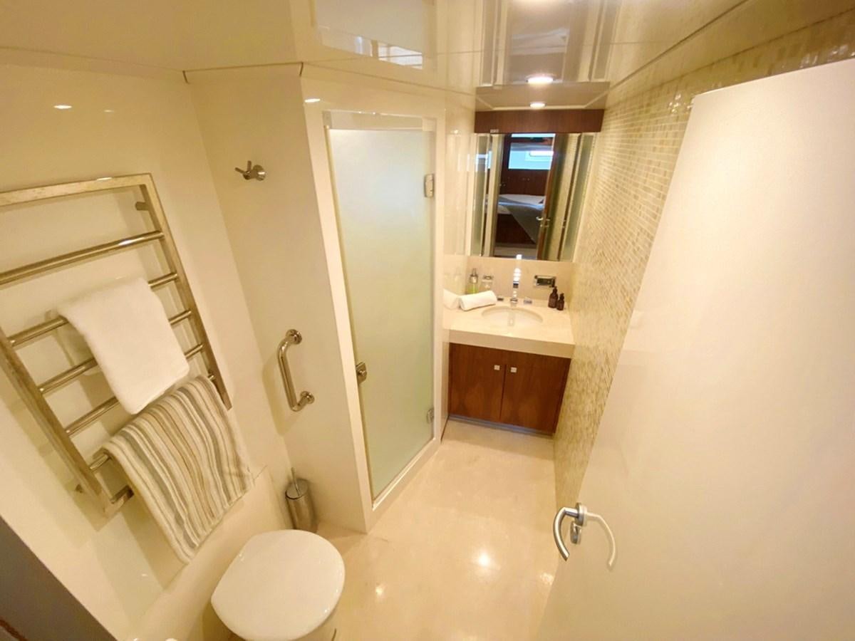 a bathroom with a toilet and a sink aboard O Yacht for Sale