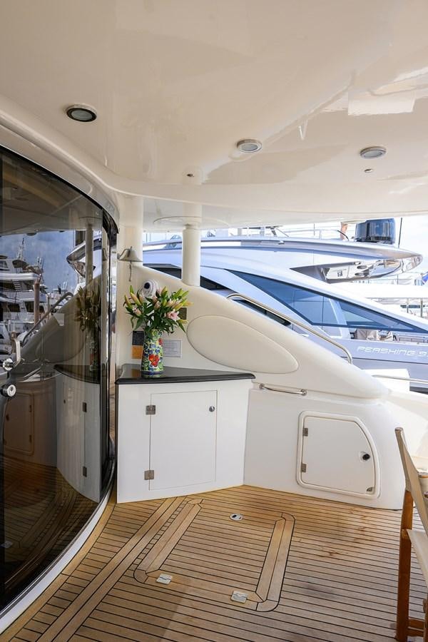 a boat with a flower pot on the deck aboard MISTRAL Yacht for Sale