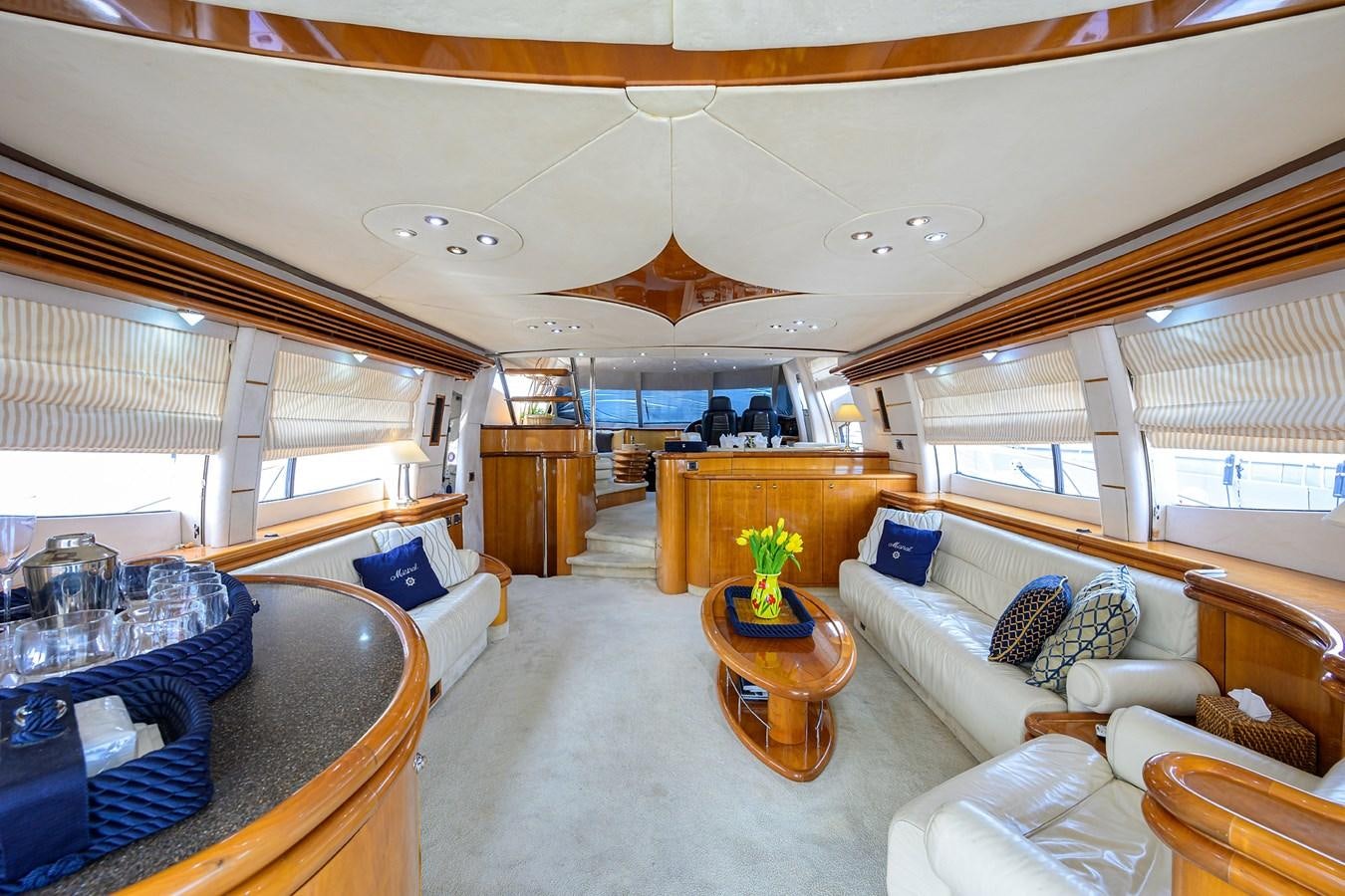 a large living room with a large open window aboard MISTRAL Yacht for Sale