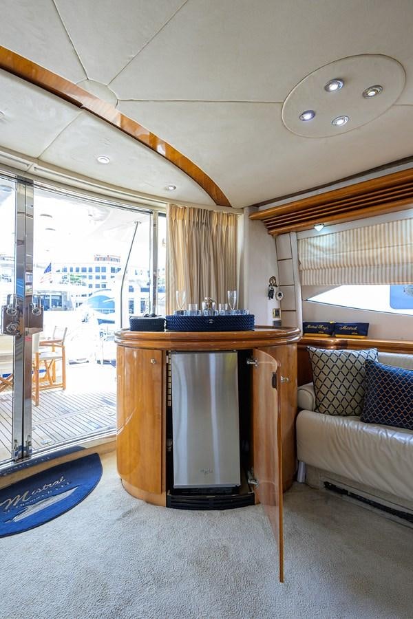 a living room with a fireplace aboard MISTRAL Yacht for Sale