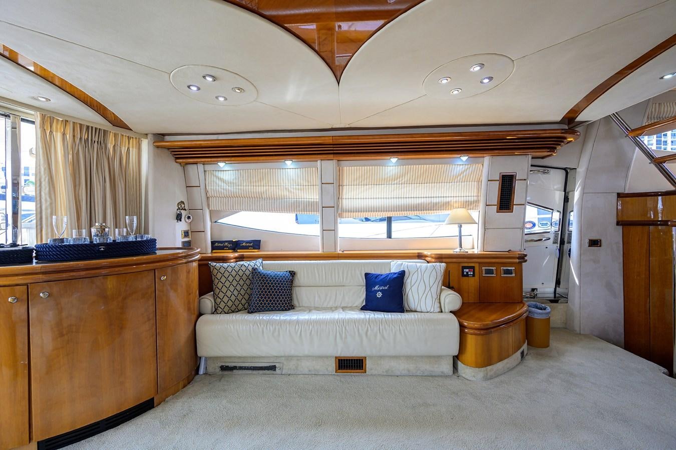 a large room with a bed and a couch aboard MISTRAL Yacht for Sale