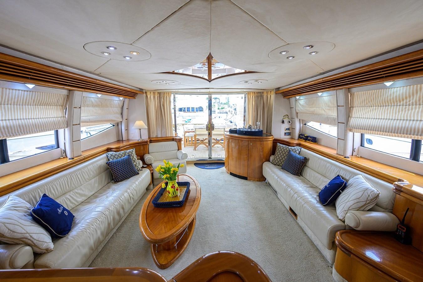 a living room with a couch and a table aboard MISTRAL Yacht for Sale