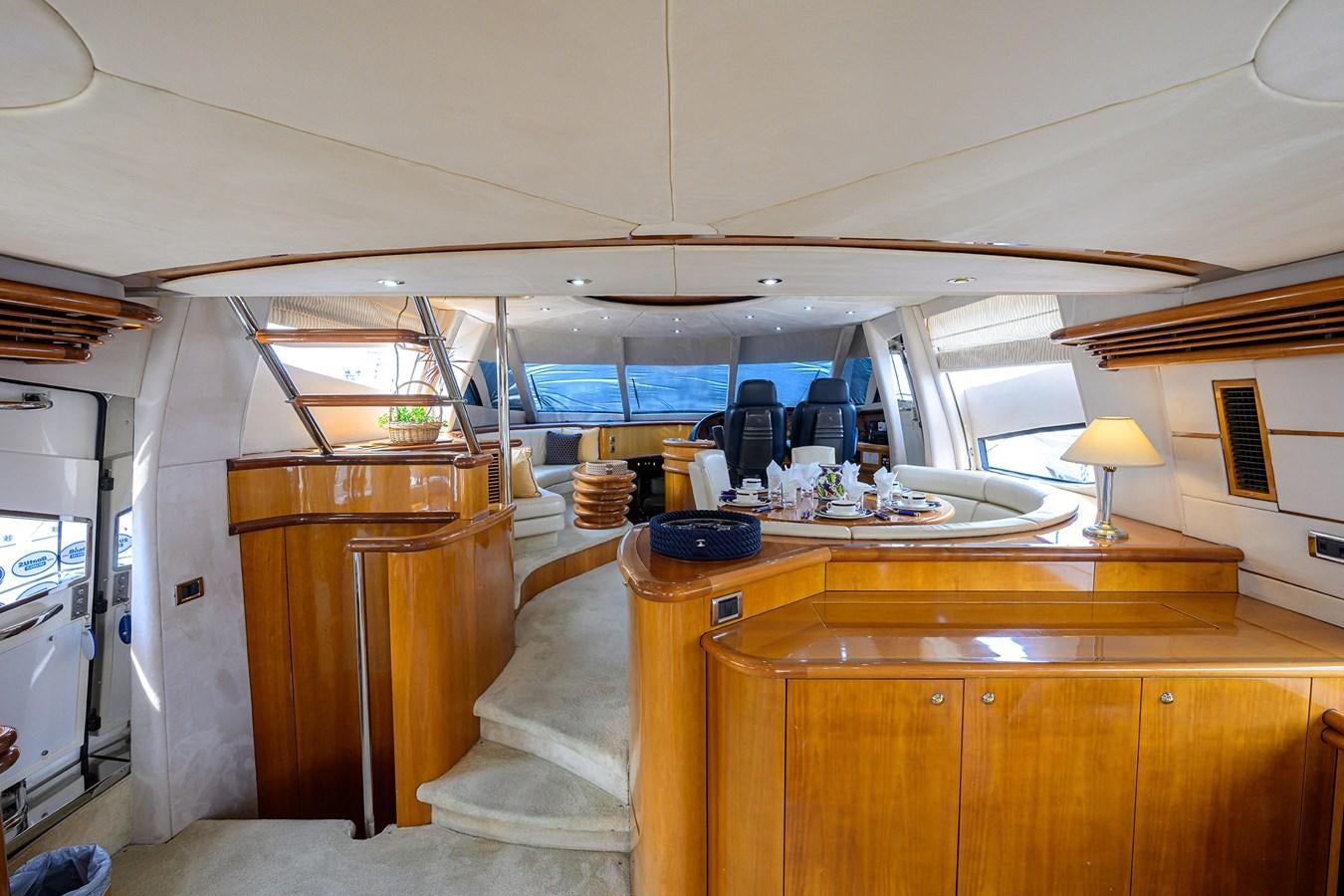 a room with a table and chairs aboard MISTRAL Yacht for Sale