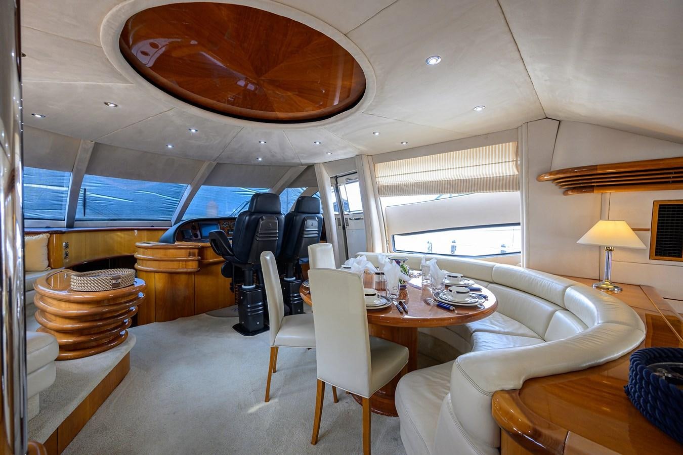 a room with a table chairs and a large window aboard MISTRAL Yacht for Sale