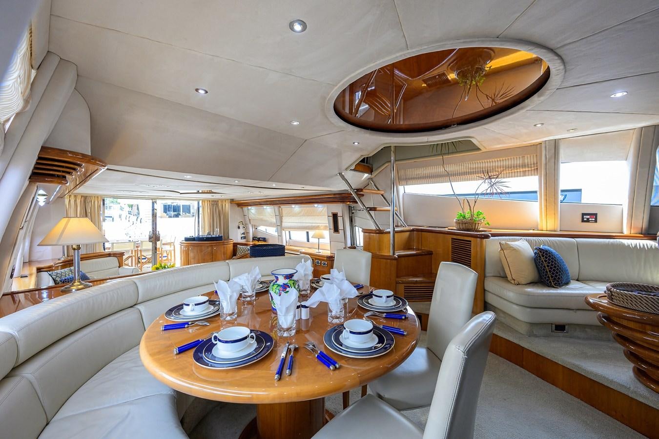 a large living room with a large chandelier aboard MISTRAL Yacht for Sale