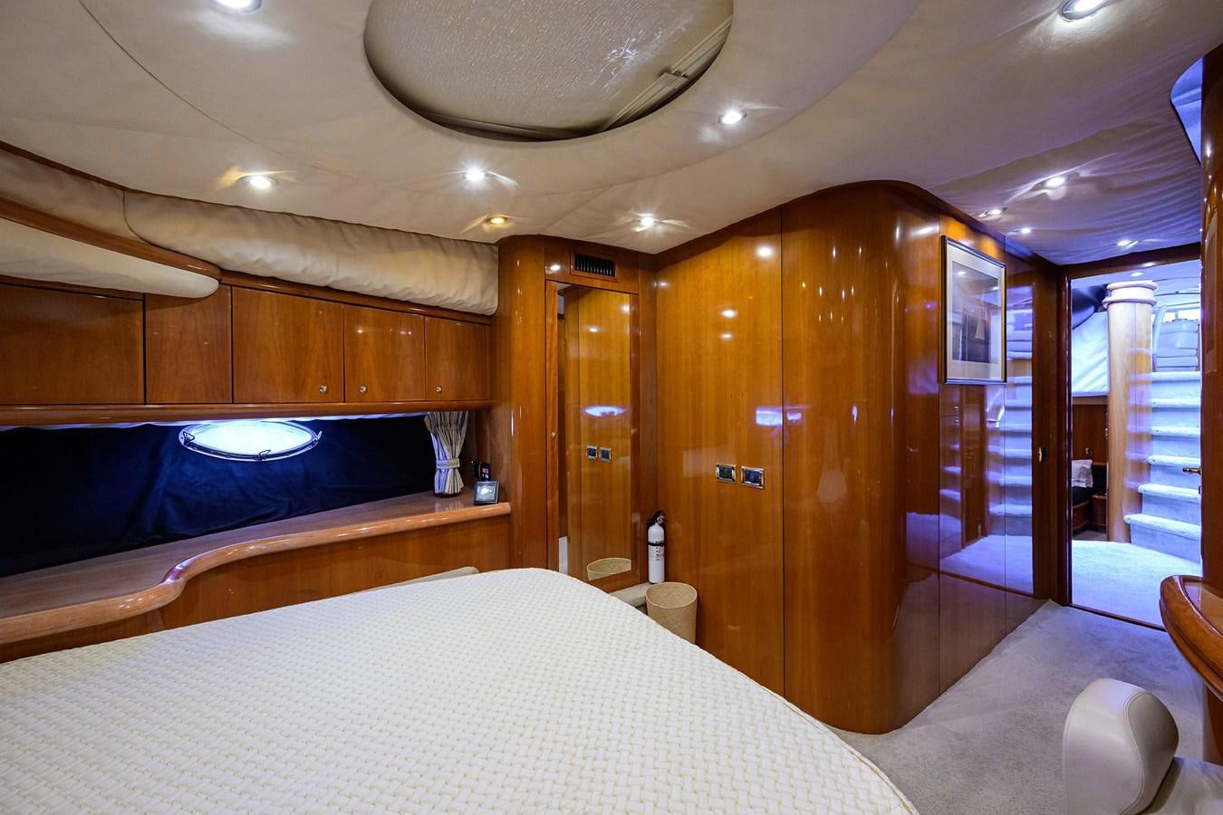 a room with a bed and a large mirror aboard MISTRAL Yacht for Sale