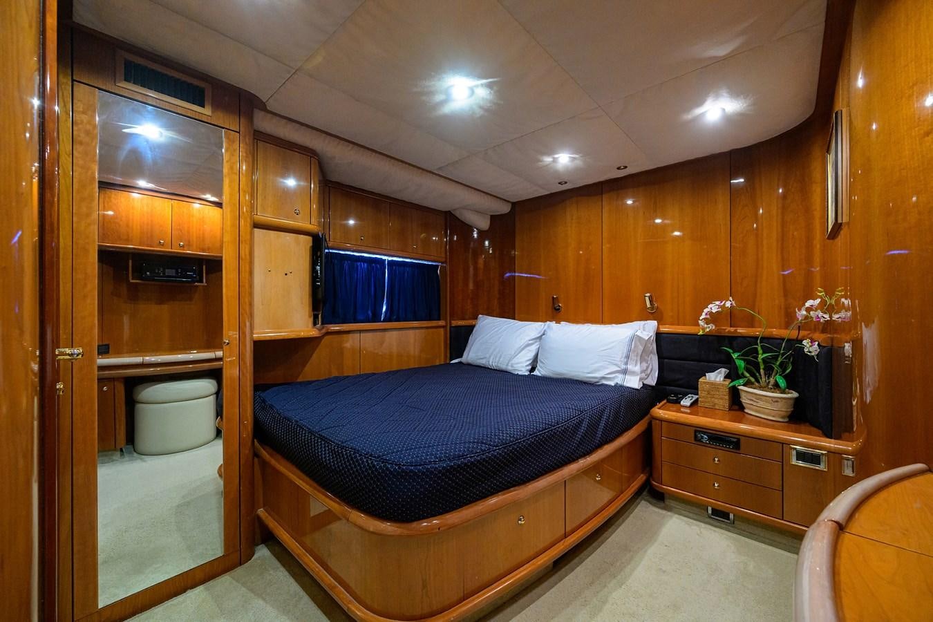 a bedroom with a bed and a desk aboard MISTRAL Yacht for Sale