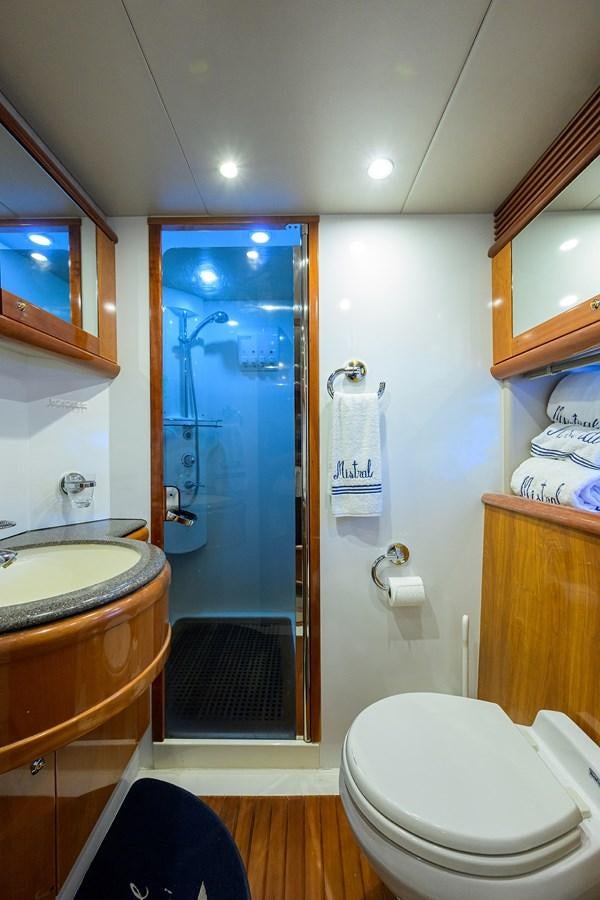 a bathroom with a glass shower door aboard MISTRAL Yacht for Sale